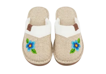 a pair of women's slippers with flowers on them