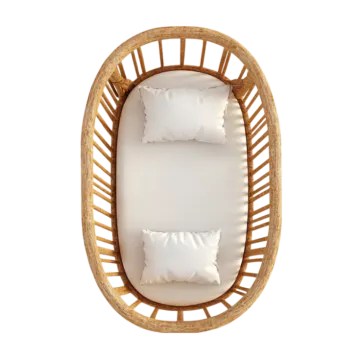 a rat rat hanging chair with white cushions