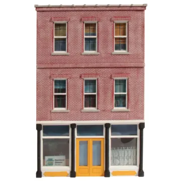 a model of a brick building with a yellow door