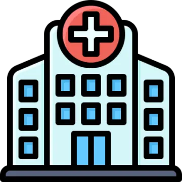 a hospital building with a cross on the front
