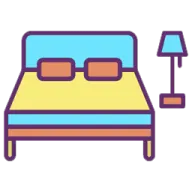 a bed with a lamp next to it