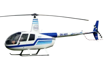 a white and blue helicopter flying through the air