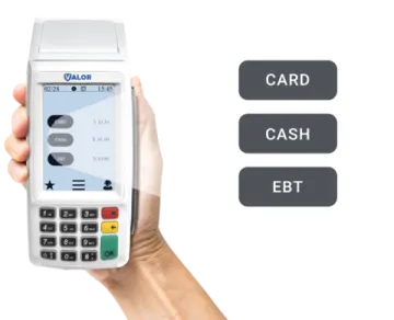 a hand holding a credit card machine