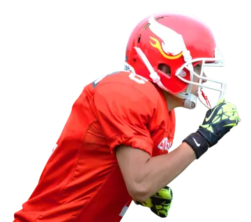 a football player wearing a helmet and holding a ball