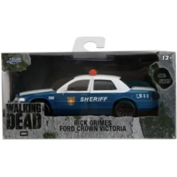 a blue and white police car on a white background