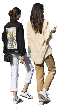 a couple of people walking down a street
