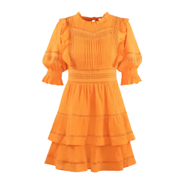 a woman in an orange dress