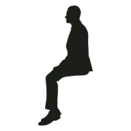 a silhouette of a man sitting on the ground