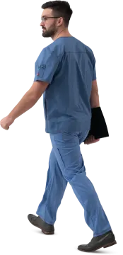 a man in scrubs walking across a white background