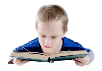 a young boy reading a book