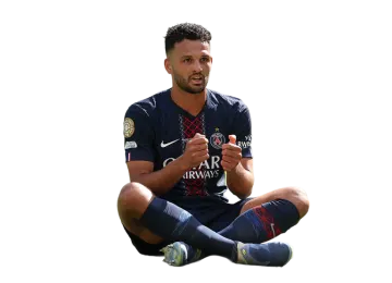 a man sitting on the ground holding a soccer ball