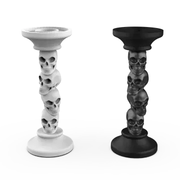 a pair of candles with skulls on them