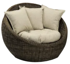 a brown wicker chair with pillows on it