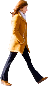 a woman in a yellow coat is walking