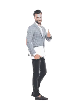 a man in a suit and tie standing with his thumbs up