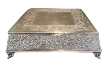 a silver box with floral design