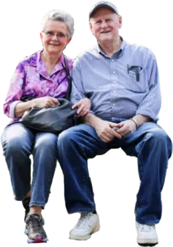 a man and woman sitting on a bench