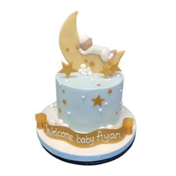 a baby is sleeping on top of a cake