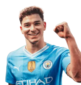 a man in a blue shirt with his fist up