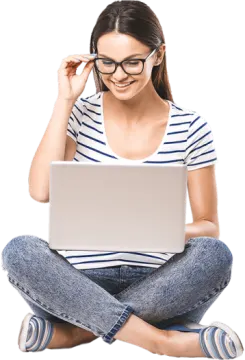 a woman sitting on the floor with her laptop