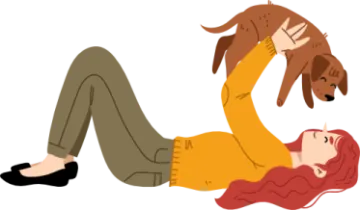 a woman laying on the ground with her dog