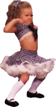 a little girl in a white dress is dancing