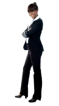a woman in a business suit standing with her arms crossed