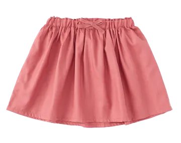 a pink skirt with a bow at the waist
