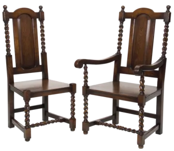 a pair of carved oak chairs