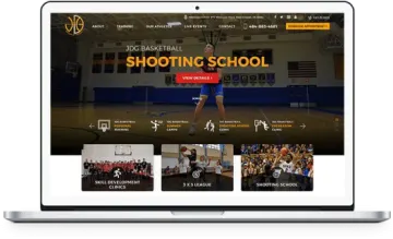the shooting school website on a laptop