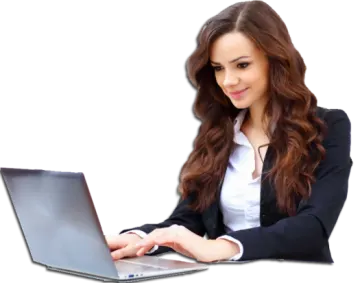 a woman sitting at a desk using a laptop