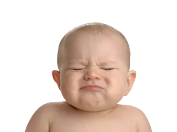 a baby crying with his eyes closed
