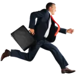 a man in a suit running with a briefcase