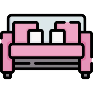 a pink couch with pillows on it