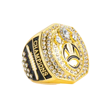 a gold ring with black and white stones