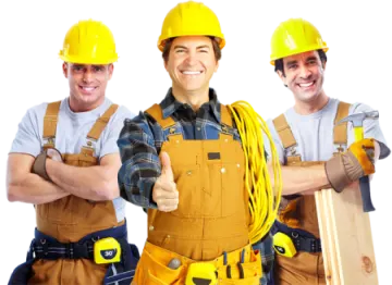 two men wearing hard hats and holding tools