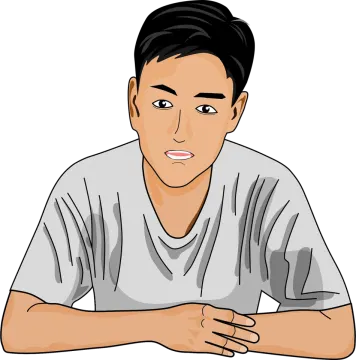 a man sitting at a table with his hand on his chin