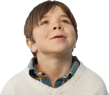 a young boy looking up at the sky