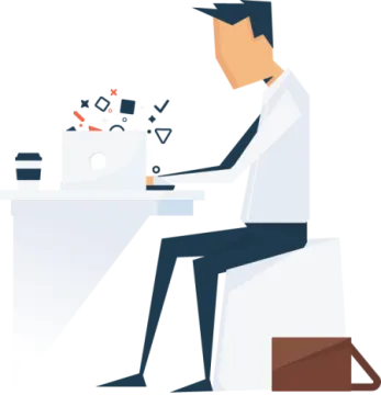 a person sitting at a desk with a laptop