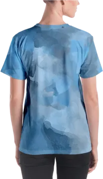a woman wearing a blue camouflage t - shirt