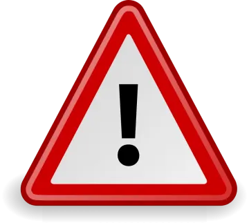 a red and white triangular sign with a black exor