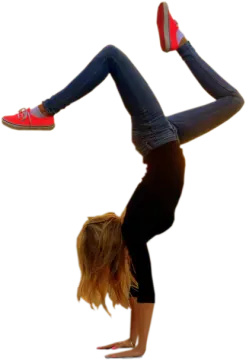 a woman doing a handstant in the air