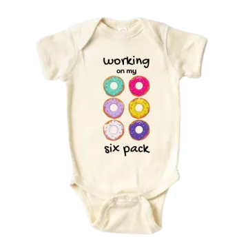 a baby bodysuit with the words working six pack on it