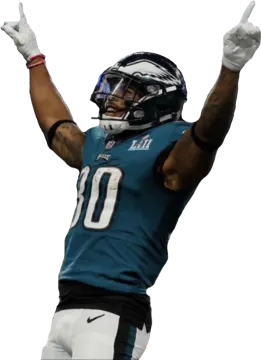 a football player with his arms up in the air