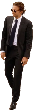 a man in a suit and tie is walking