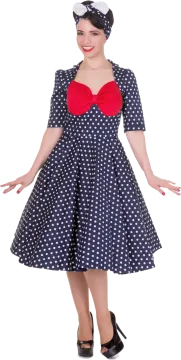 a woman in a polka dot dress