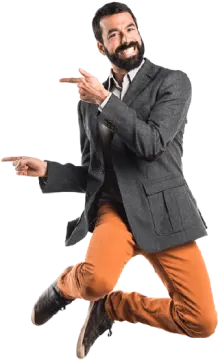 a man in a suit and tie is jumping