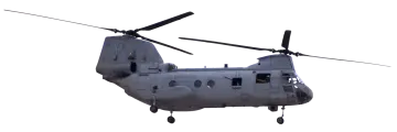 a military helicopter flying in the sky