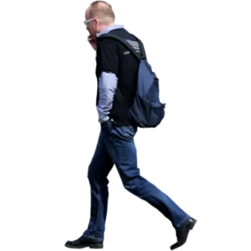 a man walking with a backpack on his back