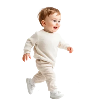 a baby in a white sweater and pants